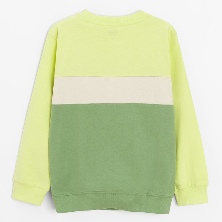 Green sweatshirt with funny creature