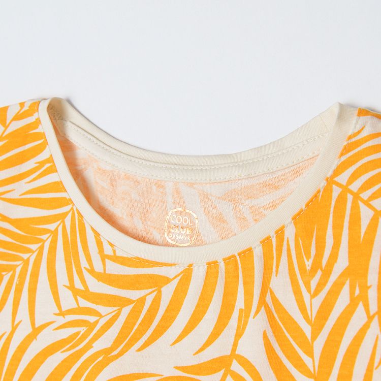 White short sleeve blouse with yellow leaves print