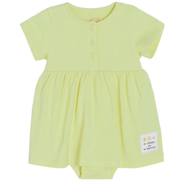 Yellow short sleeve bodysuit with skirt and buttons on the top