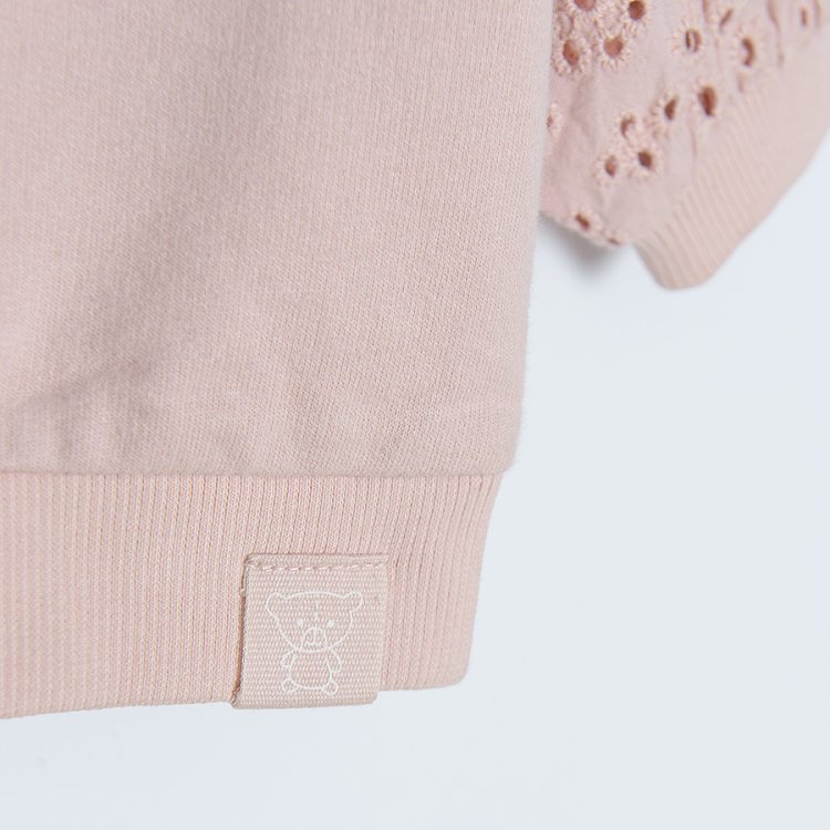 Light pink sweatshirt with embroidered sleeves
