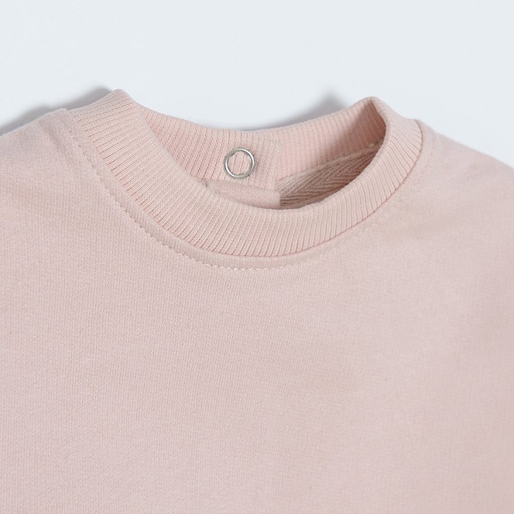 Light pink sweatshirt with embroidered sleeves