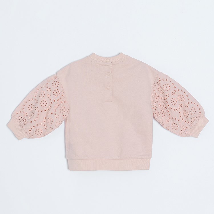 Light pink sweatshirt with embroidered sleeves