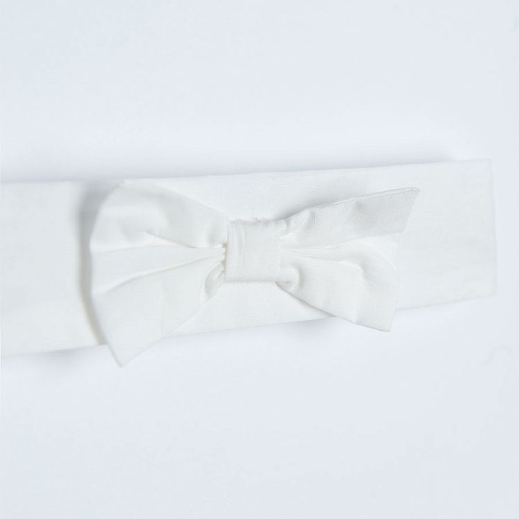 White sleeveless dress/bodysuit with flowers on the skirt and matching headband