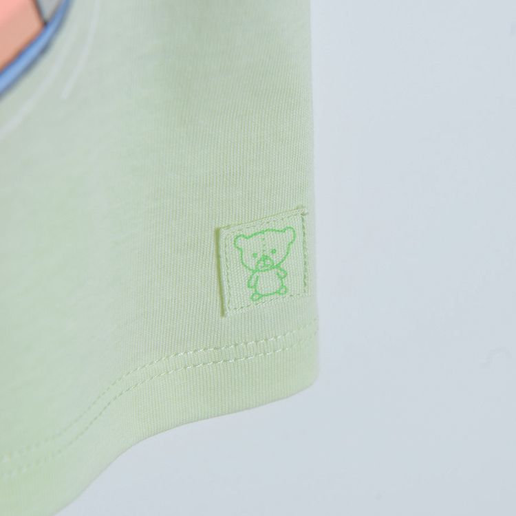 Light green short sleeve T-shirt with flamingo floatie
