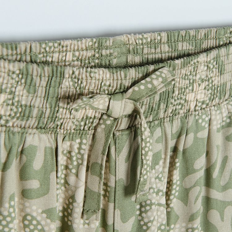 Tuquoise wide trousers with white flower patterns