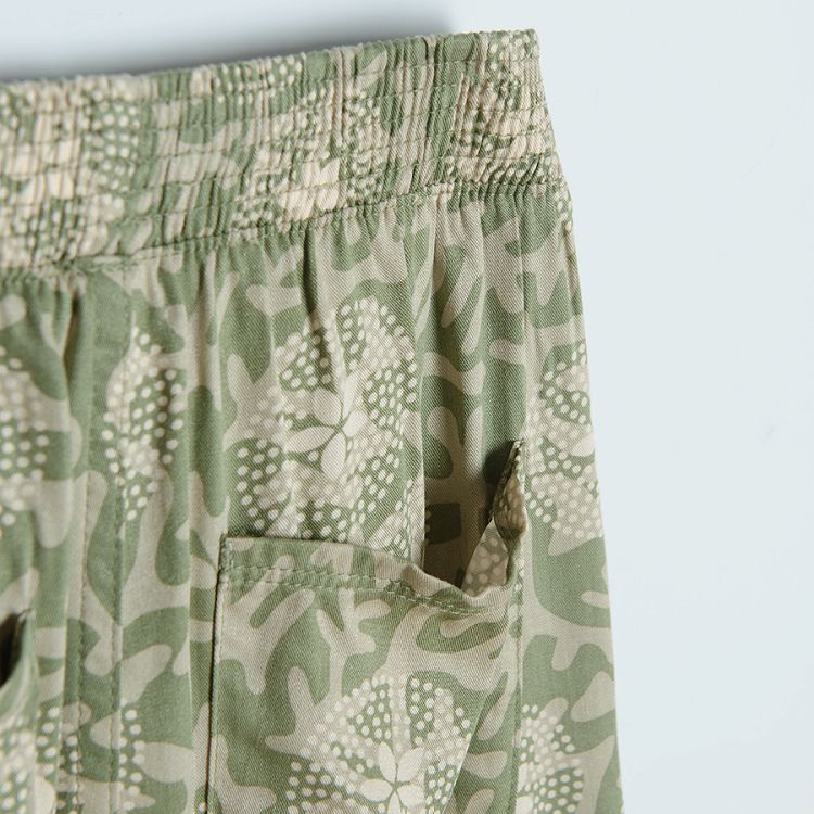 Tuquoise wide trousers with white flower patterns