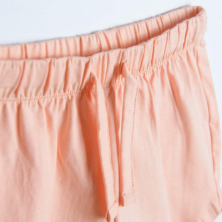 Peach shorts with elastic waist and bow