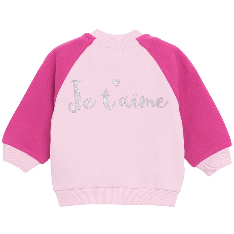 Pink button down sweatshirt with 'Je t'aime' print on the back