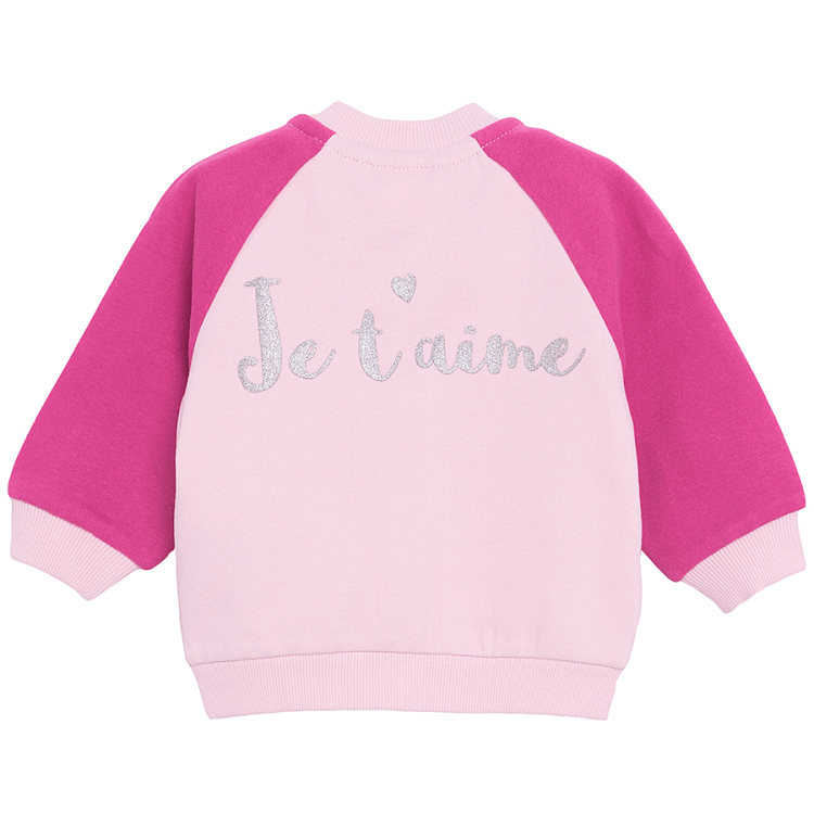 Pink button down sweatshirt with 'Je t'aime' print on the back