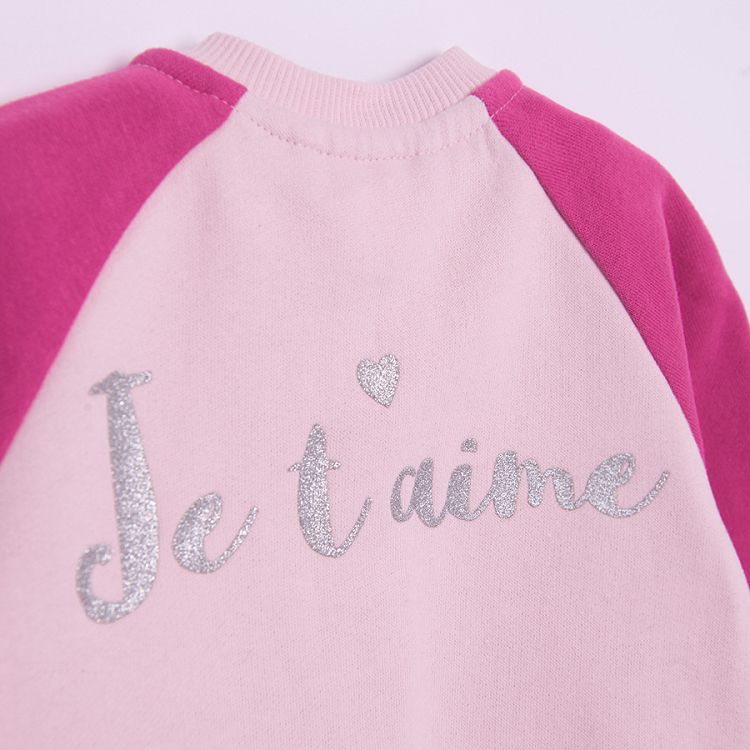 Pink button down sweatshirt with 'Je t'aime' print on the back