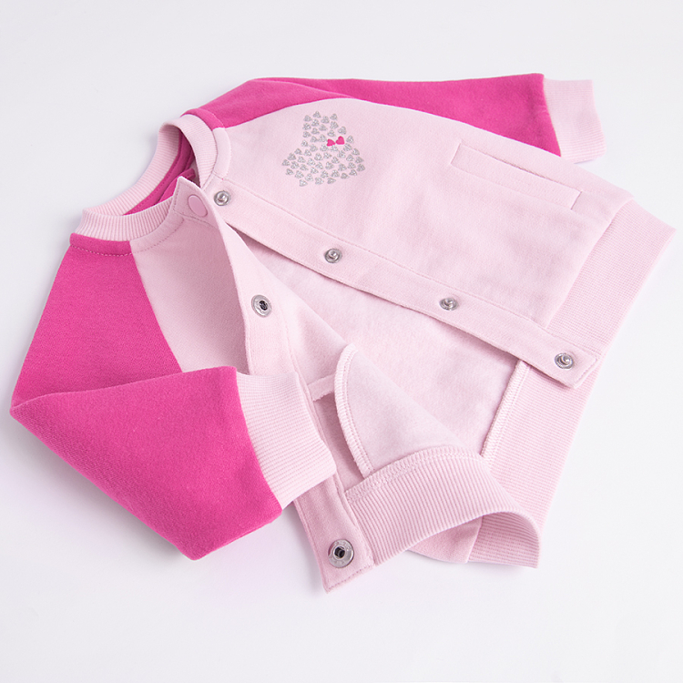 Pink button down sweatshirt with 'Je t'aime' print on the back