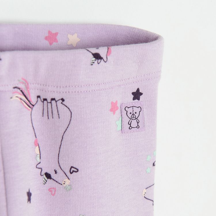 Purple leggings with unicorns print