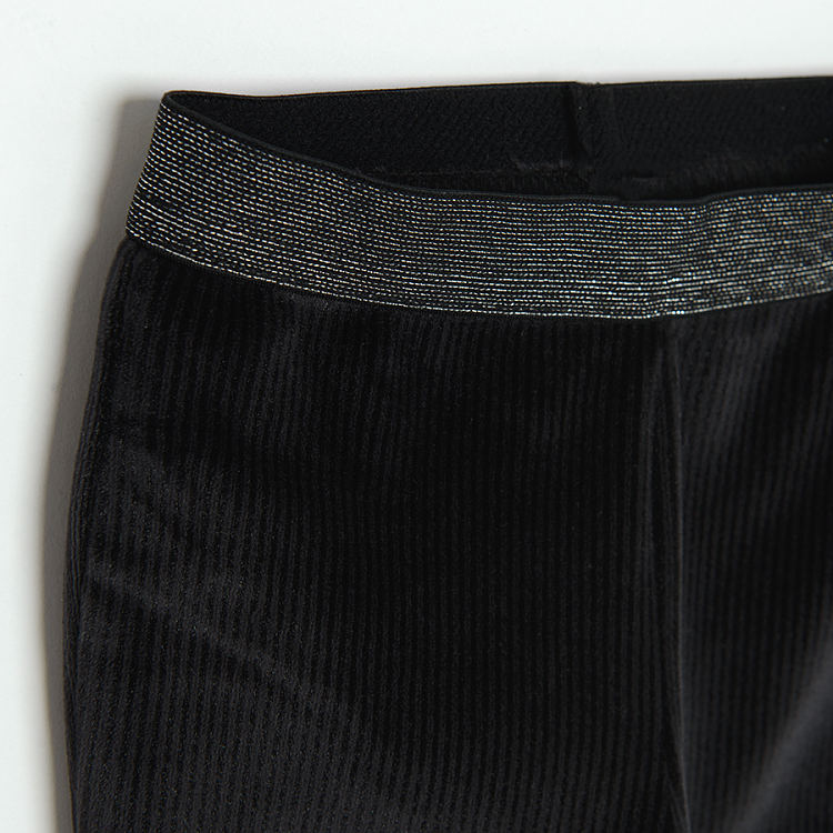 Black wide leg jeggings with silver elastic belt