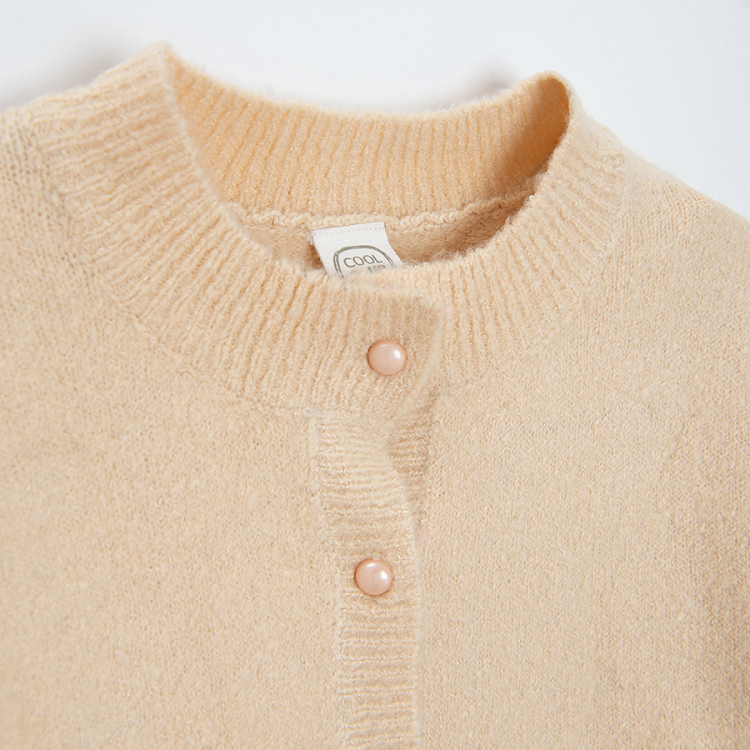 White cardigan with raindeer print on the side pockets