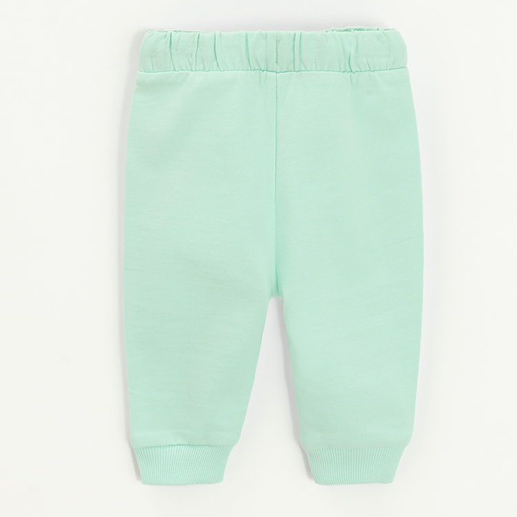 Lint sweatpants with elastic around the ankles and cord