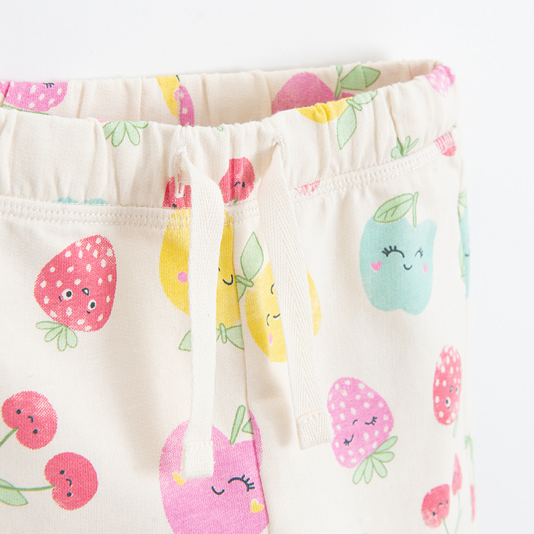 White sweatpants with cord and fruit print