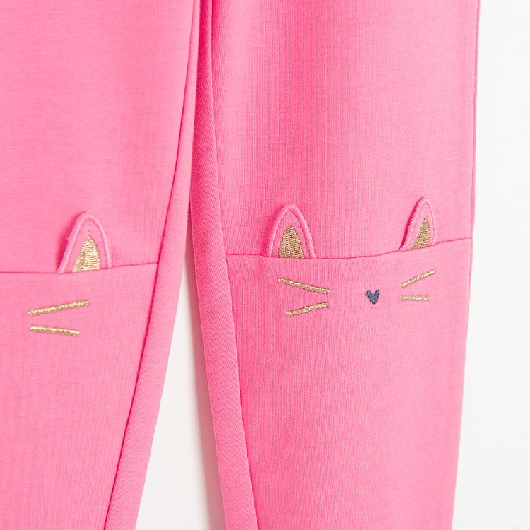 Pink leggings with kitten face print on the knees