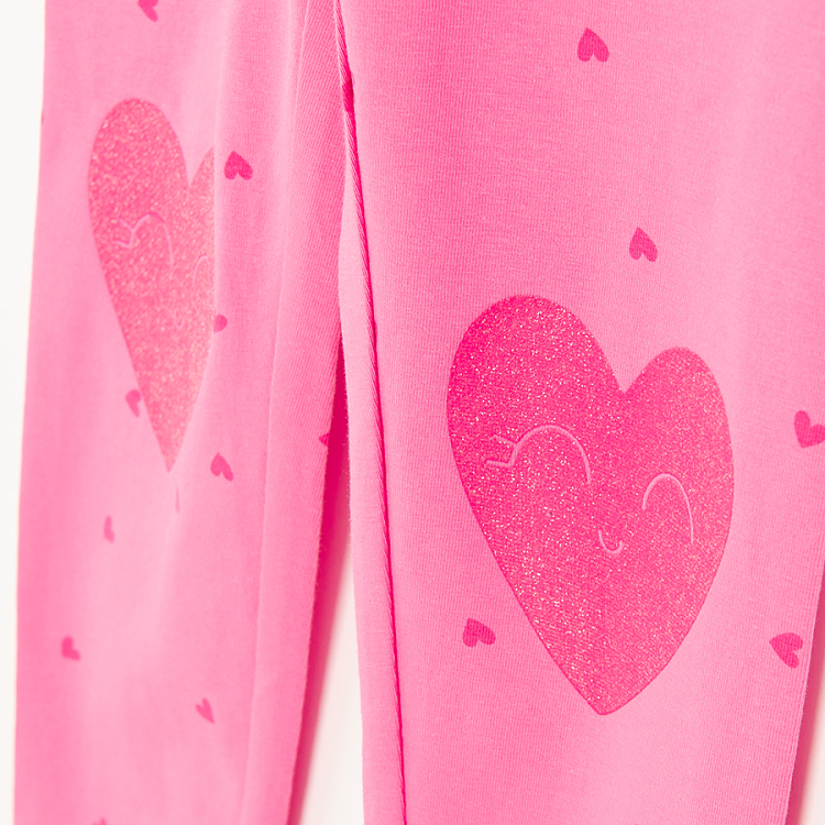 Pink leggings with red hearts print