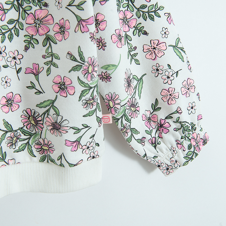 White floral sweatshirt with ruffles on the shoulders