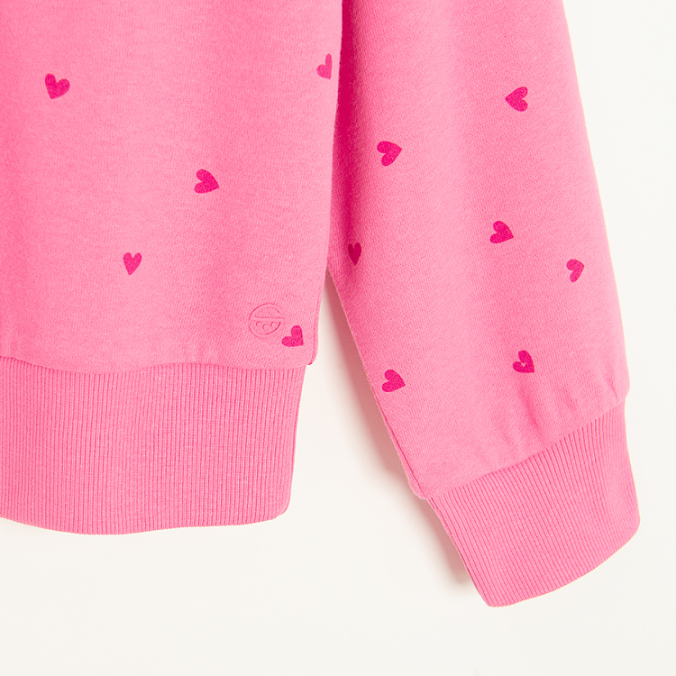 Pink sweatshirt with red hearts print