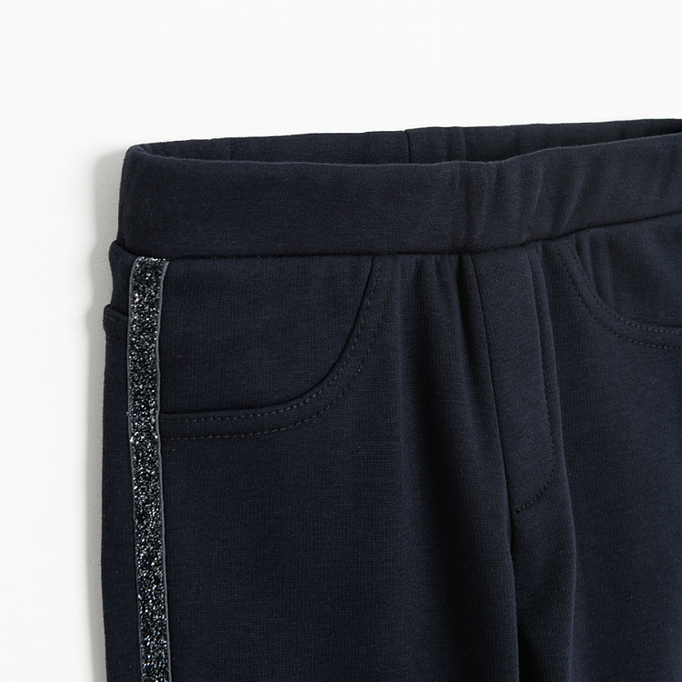 Blue jeggings with gold stripe