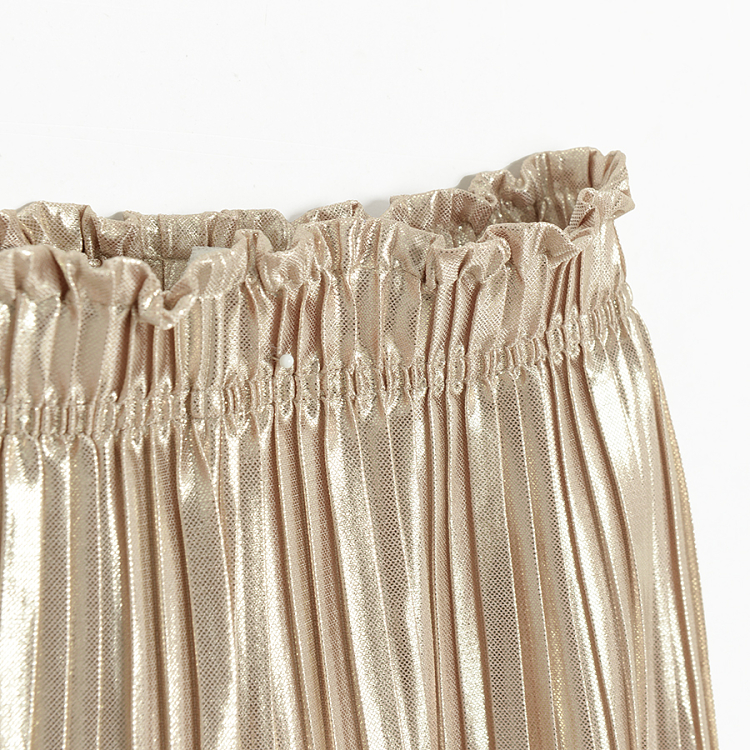 Gold pleated trousers