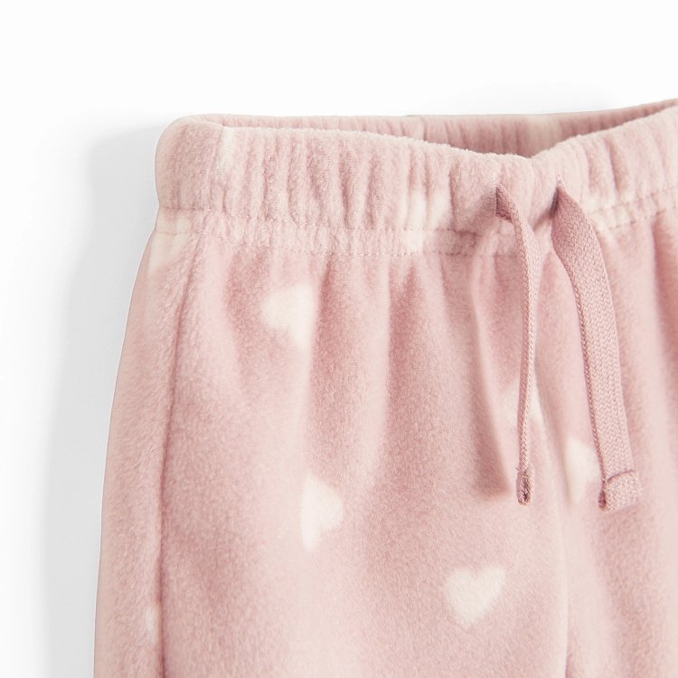 Σετ φόρμα 2 τμχ. ζακέτα fleece με φερμουάρ ροζ και παντελόνι φόρμα ροζ με στάμπα καρδούλες
