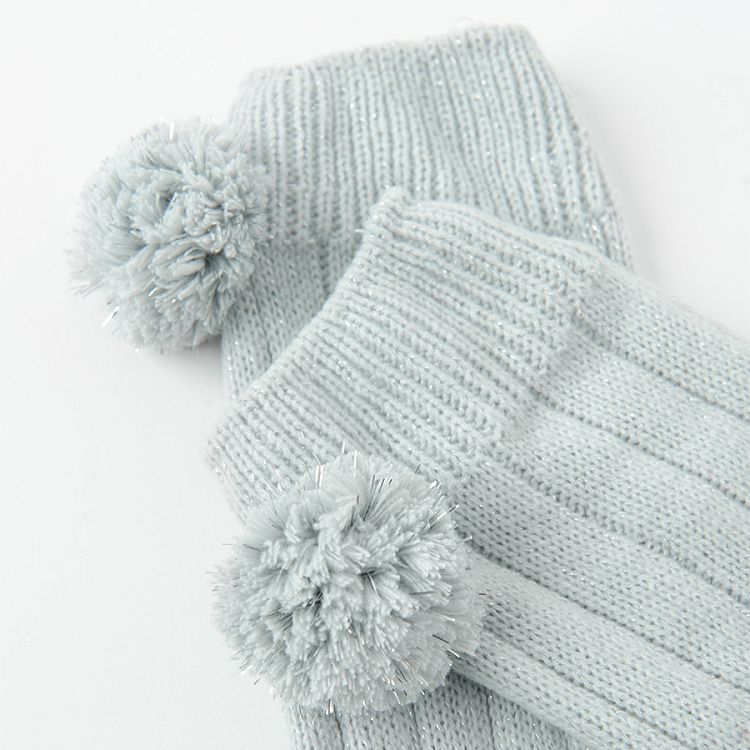 Grey warmers with pom poms
