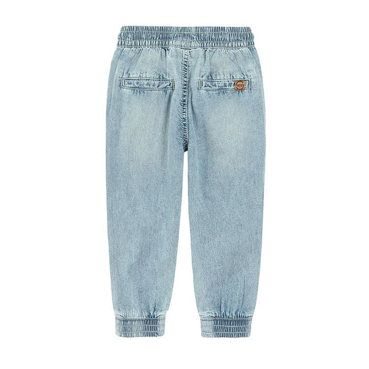 Denim trousers with elastic waist and cord and elastic band around the ankles