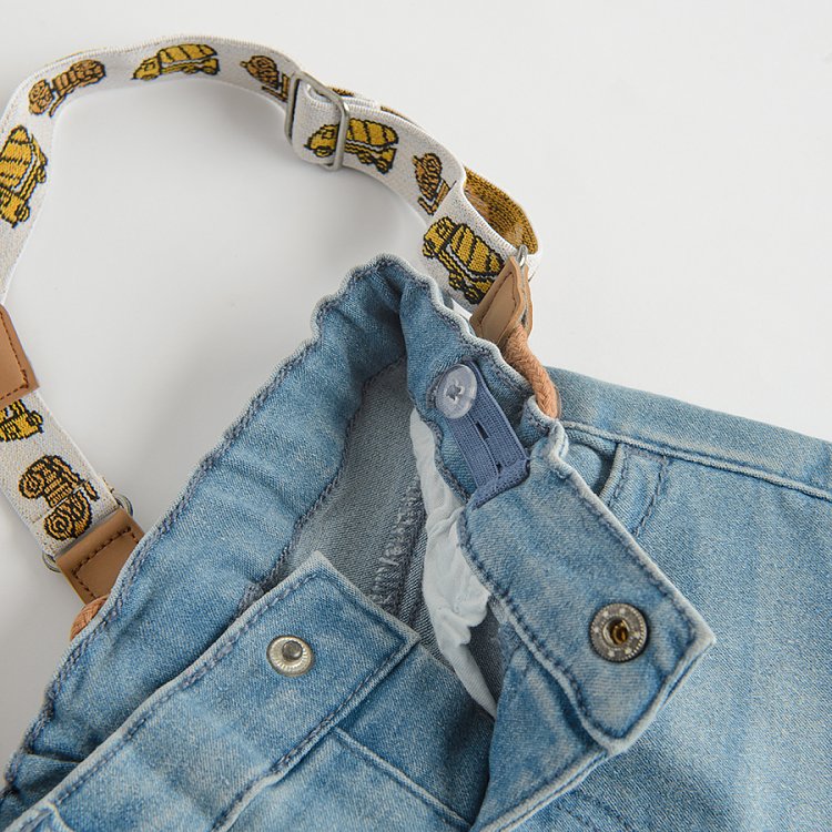 Denim pants with decorative straps