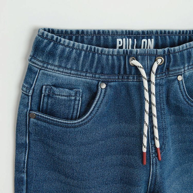 Dark blue denim with cord in the waist