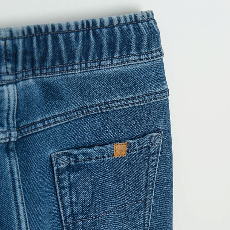 Dark blue denim with cord in the waist