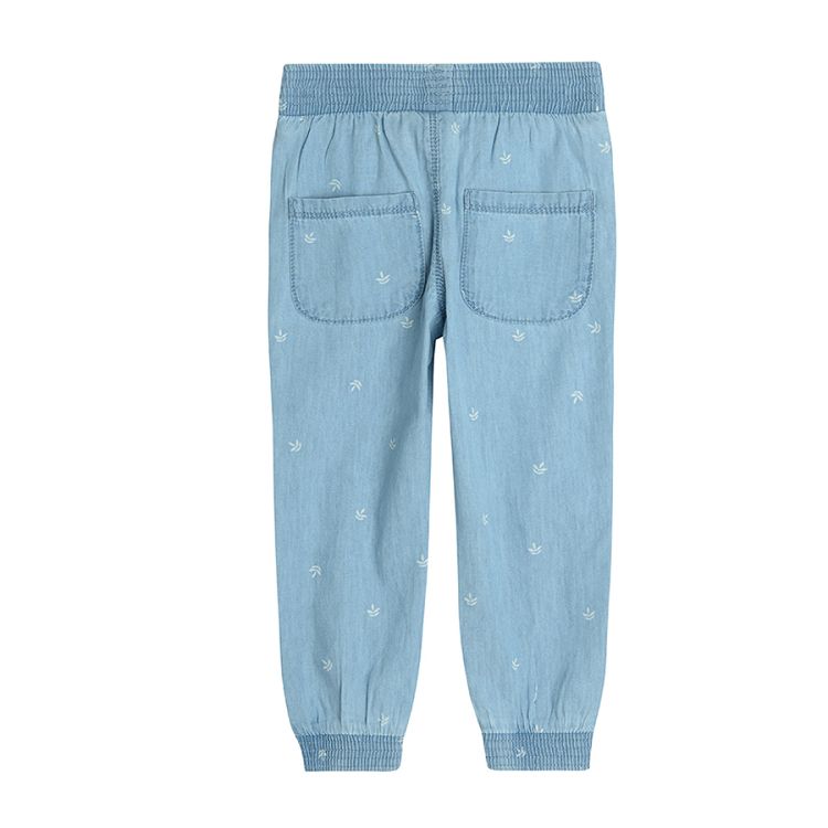 Denim trousers with elastic waist and ankles with leaves print