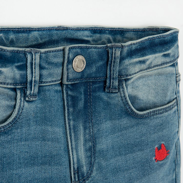 Denim trousers with small cats face embroidered