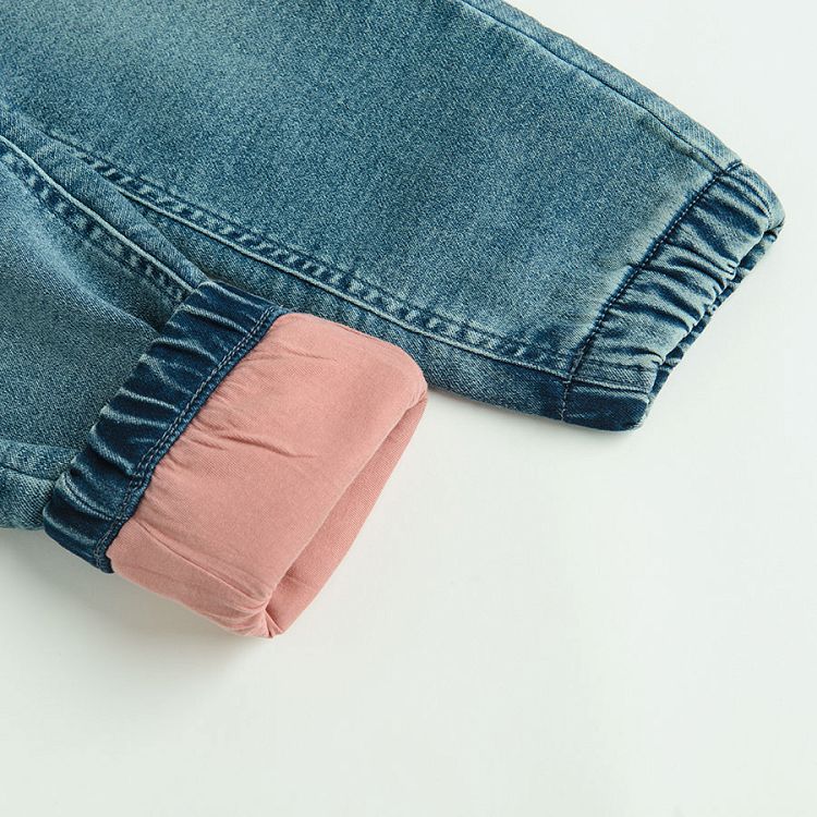 Denim pants with kitten prints on the pockets and pink lining