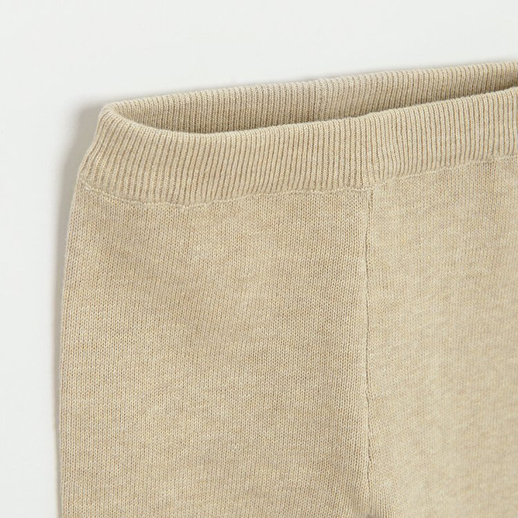Ecru footless leggings with bear face on the knees