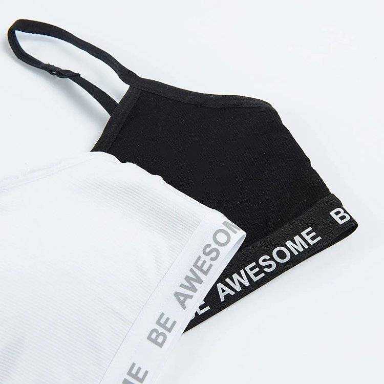 White and black bras with Be awesome print on the elastic band