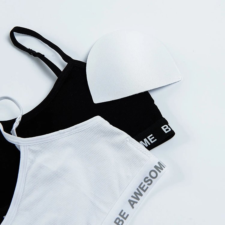 White and black bras with Be awesome print on the elastic band