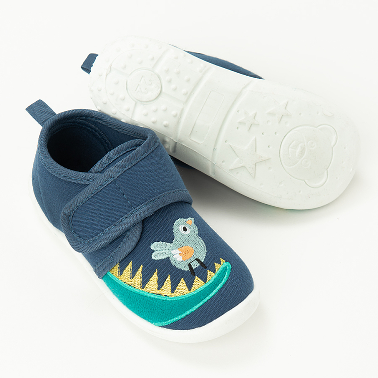 Blue slippers with dinosaurs print and scratch