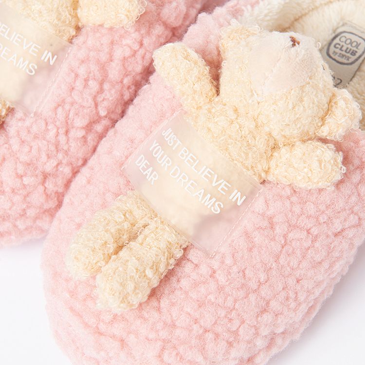 Pink fluffy slippers with bear on top
