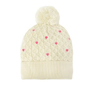White cap with small hearts and pom pom