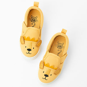 Dark yellow slippers with lion pattern