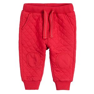 Red jogging pants