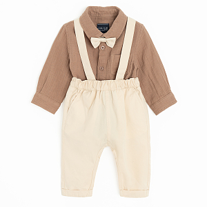 Brown bodysuit with bow tie and ecru pants with suspenders