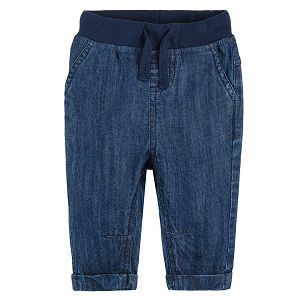 Light blue denim trousers with adjustable waist