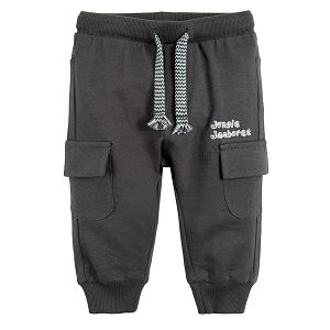 Graphite jogging pants with adjustable waist elastic band around the ankles and pockets