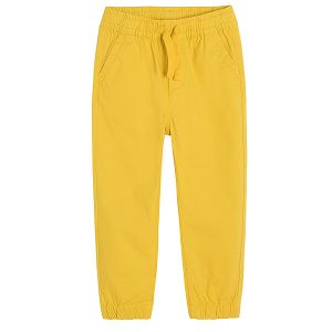 Yellow trousers with adjustable waist