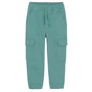 Blue trousers with adjustable waist and side pockets