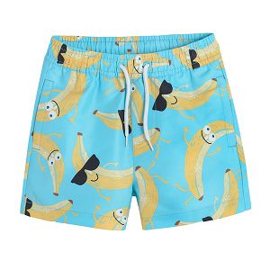 Light blue swimming shorts with bananas wearing glasses print