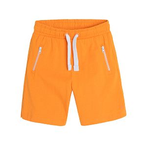 Orange shorts with adjustable waist and pockets